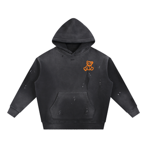 Plushy After Dark hoodie front, washed charcoal vintage wash hoodie with orange drip X-eyed teddy bear on left chest
